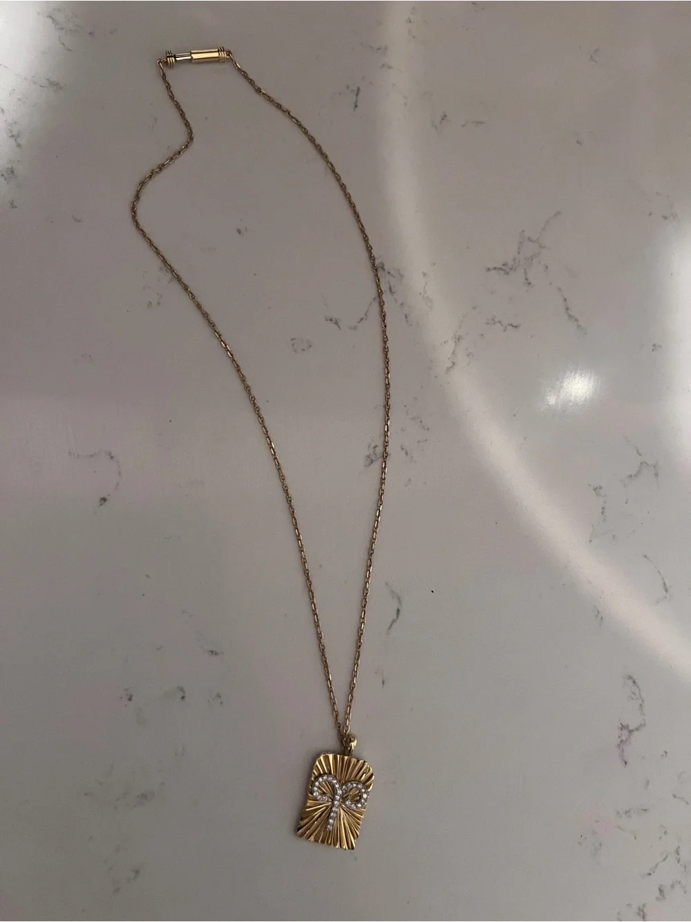 Gold-Tone Radiant Rectangle Pendant Necklace with Crystal Detail